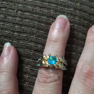 Gold tone light blue stones size 7 ring